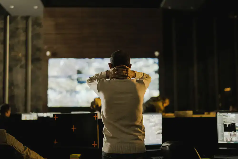 Tournament administrators monitoring live match screens